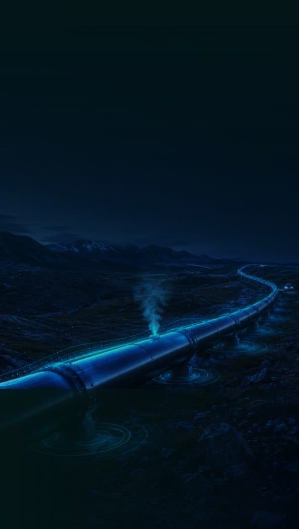 A pipeline crossing remote terrain at night with a detected leak plume